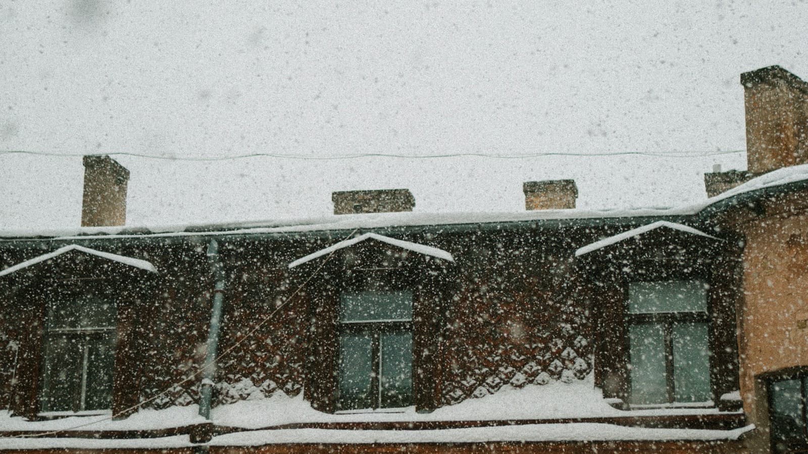 Snow buildup on a roofline during winter weather