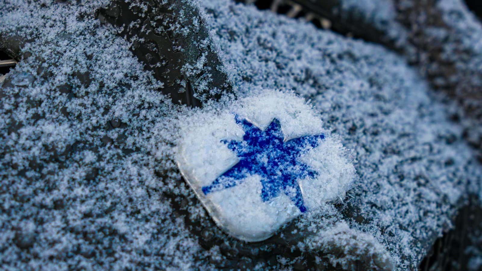 Icy surface detail representing winter de-icing and salting