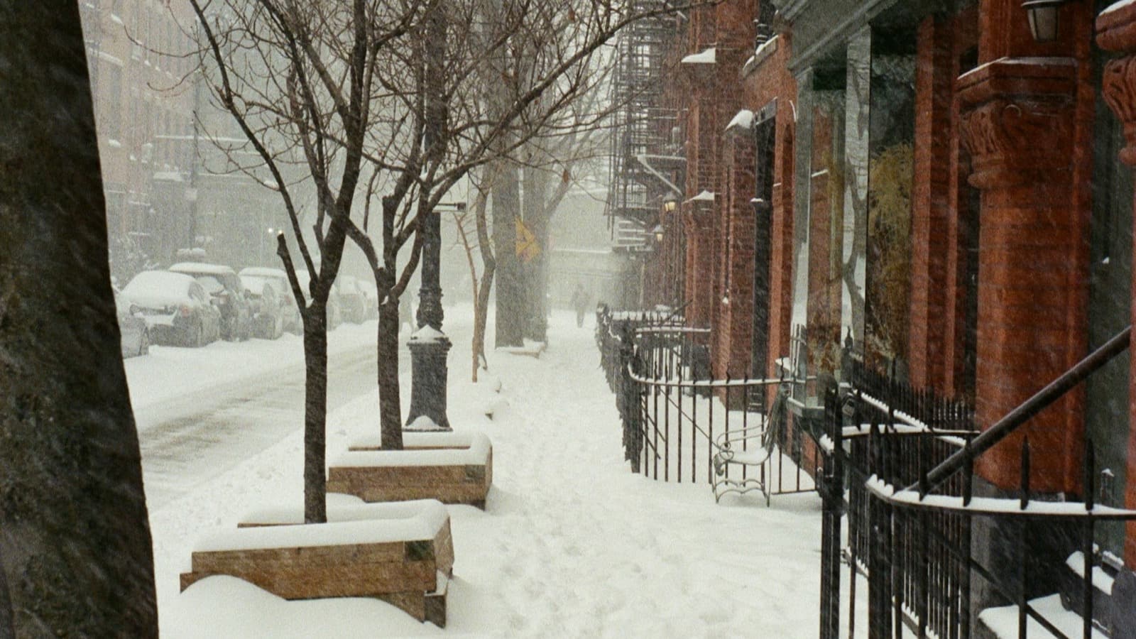 Snowy city sidewalk requiring clearing for safe access